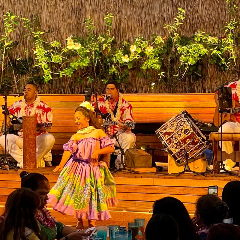 a group of people sitting on a bench
